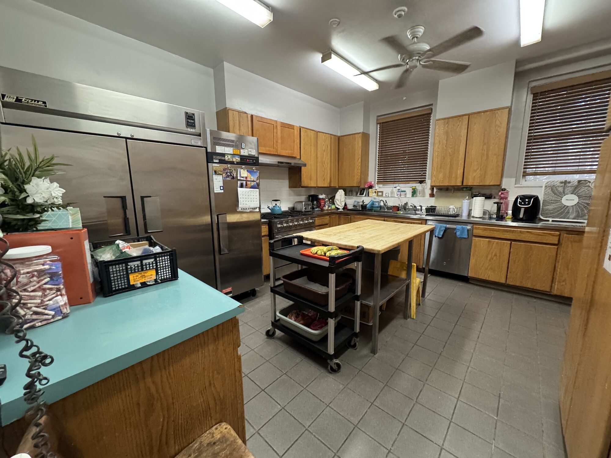 Equipped event kitchen with commercial refrigerators, range and prep table