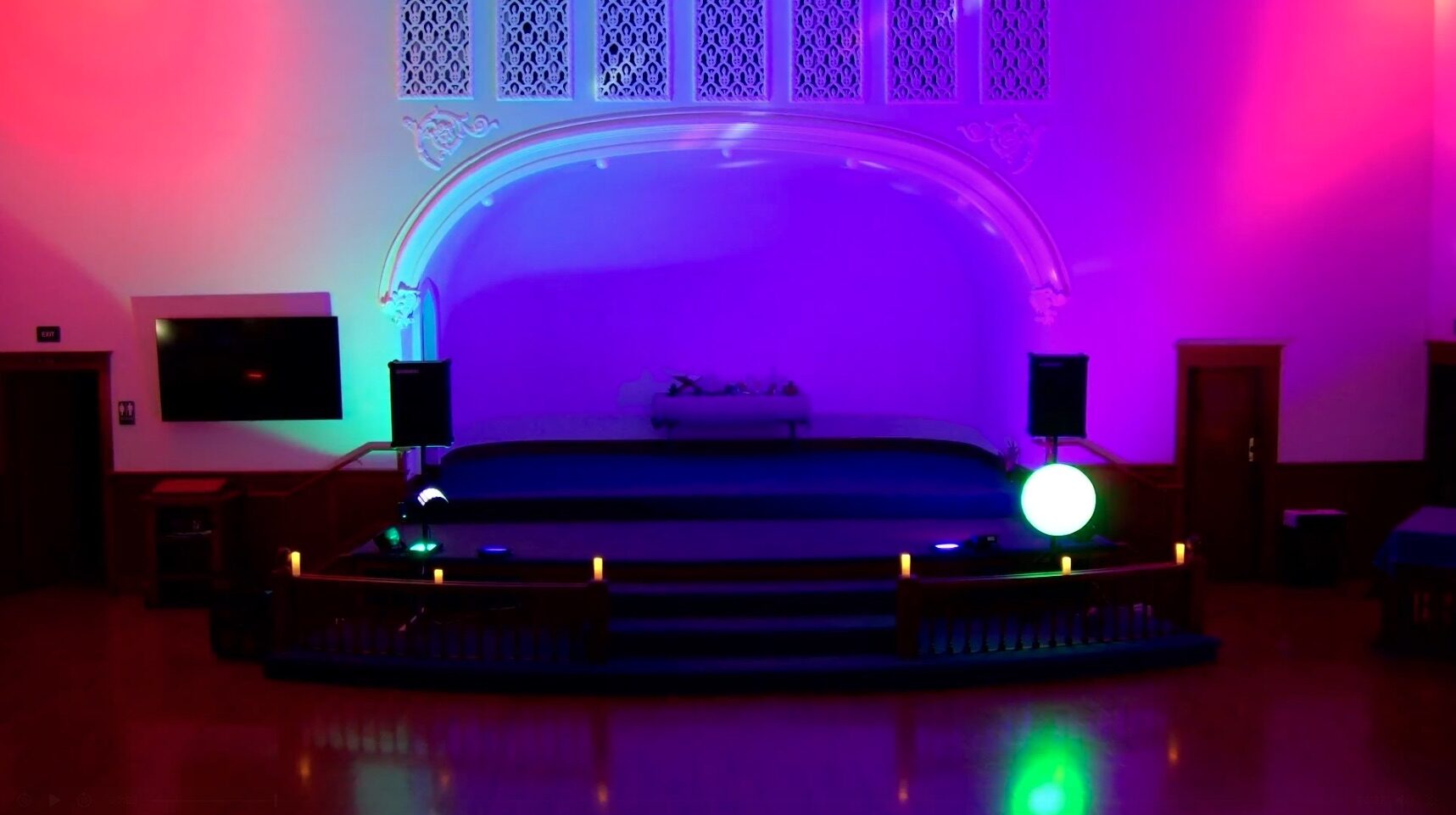 Main-room stage illuminated with colorful event lighting