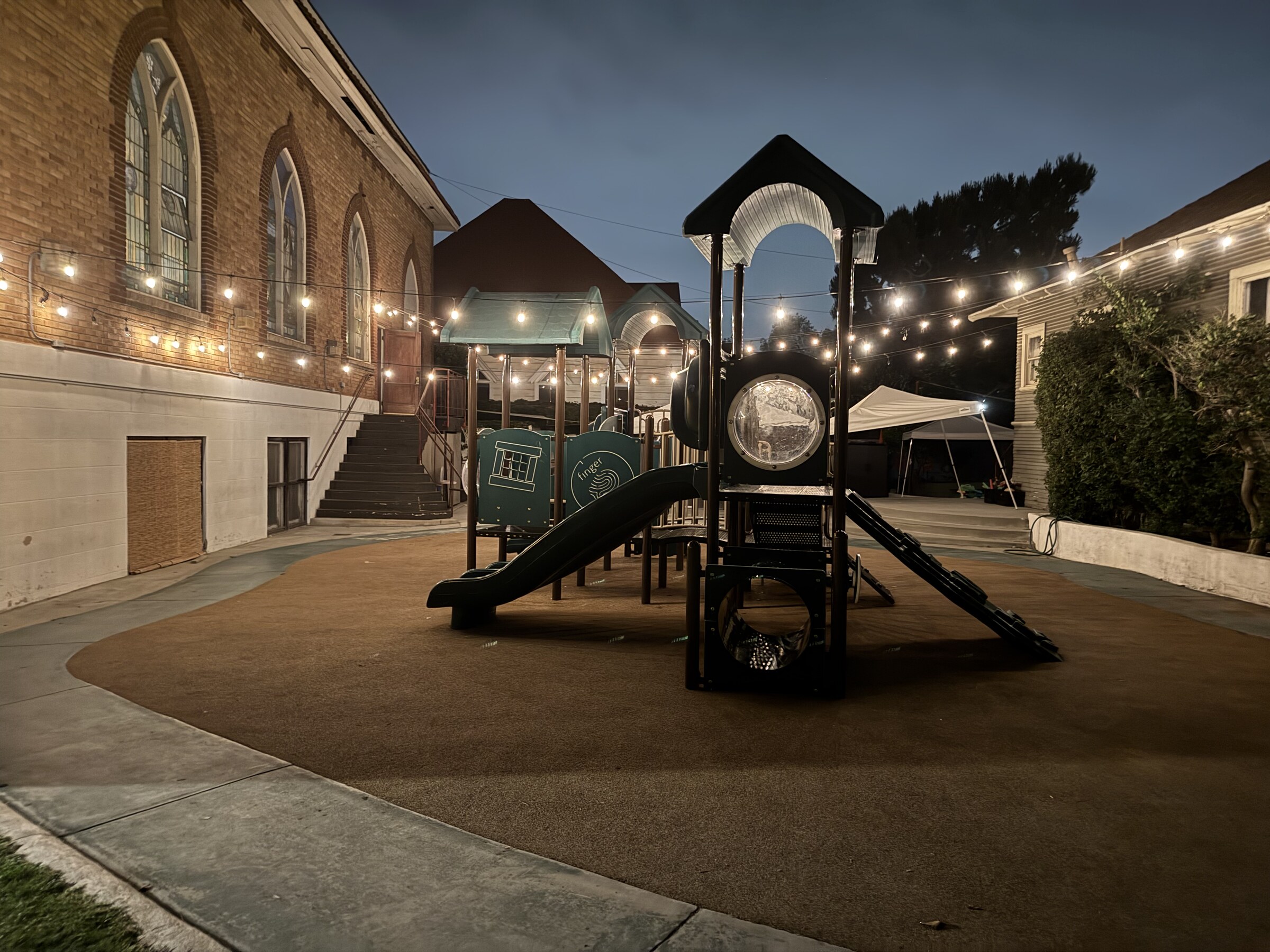 Playground and open gathering area in the private yard